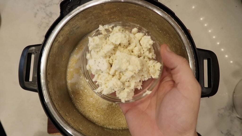 Adding herb cheese to pastina